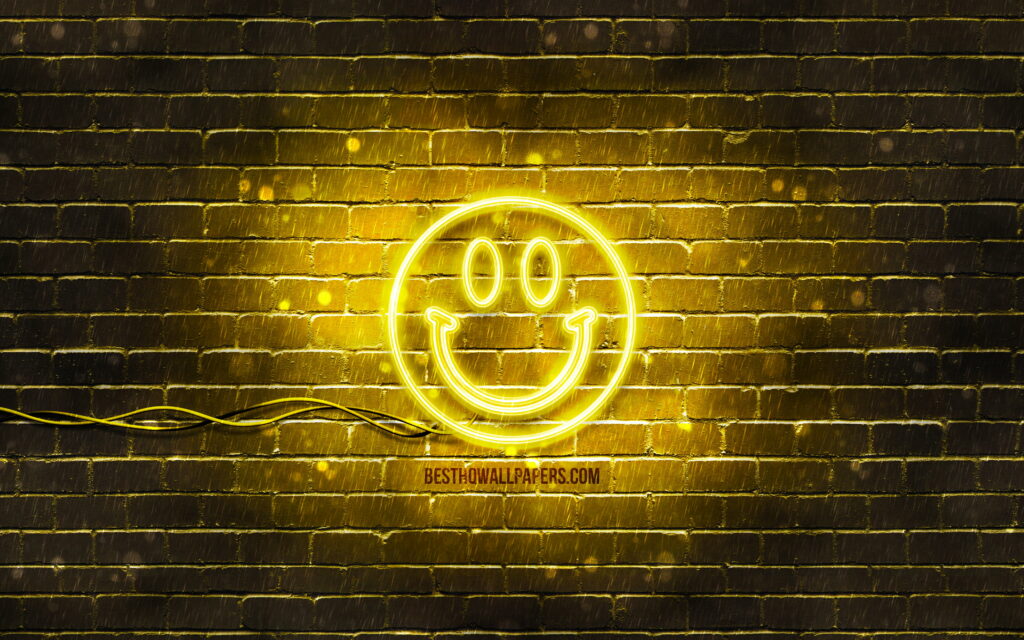 Glowing Smiles: Vibrant Neon Emoticon Collection Illuminated on a Sunny Yellow Backdrop Wallpaper