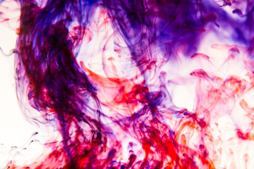 Vibrant Smoke Wallpaper: Flowing Color Patterns on Light Background