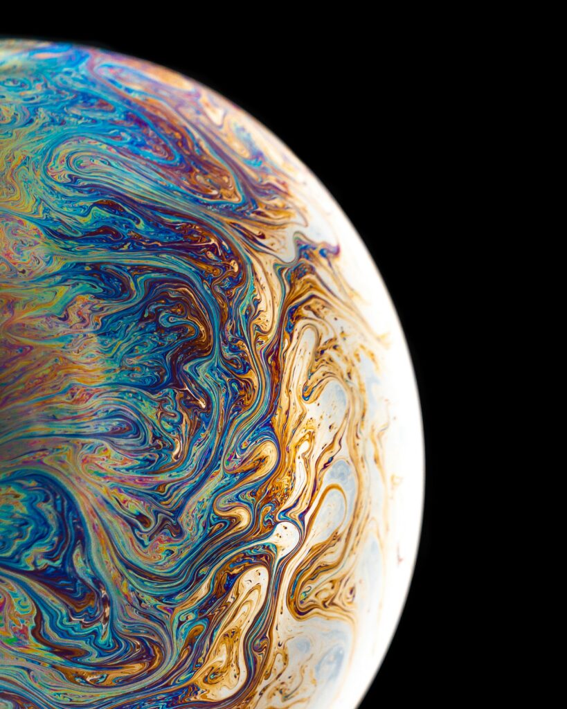 Vibrant Soap Bubble Macro: Colorful Patterns on Dark Wallpaper