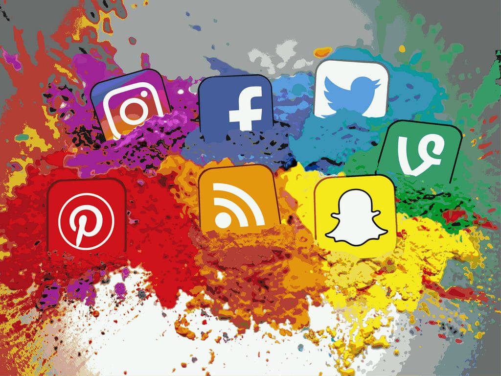 Colorful social media logos Instagram Facebook Twitter Pinterest Snapchat on abstract splash background Wallpaper