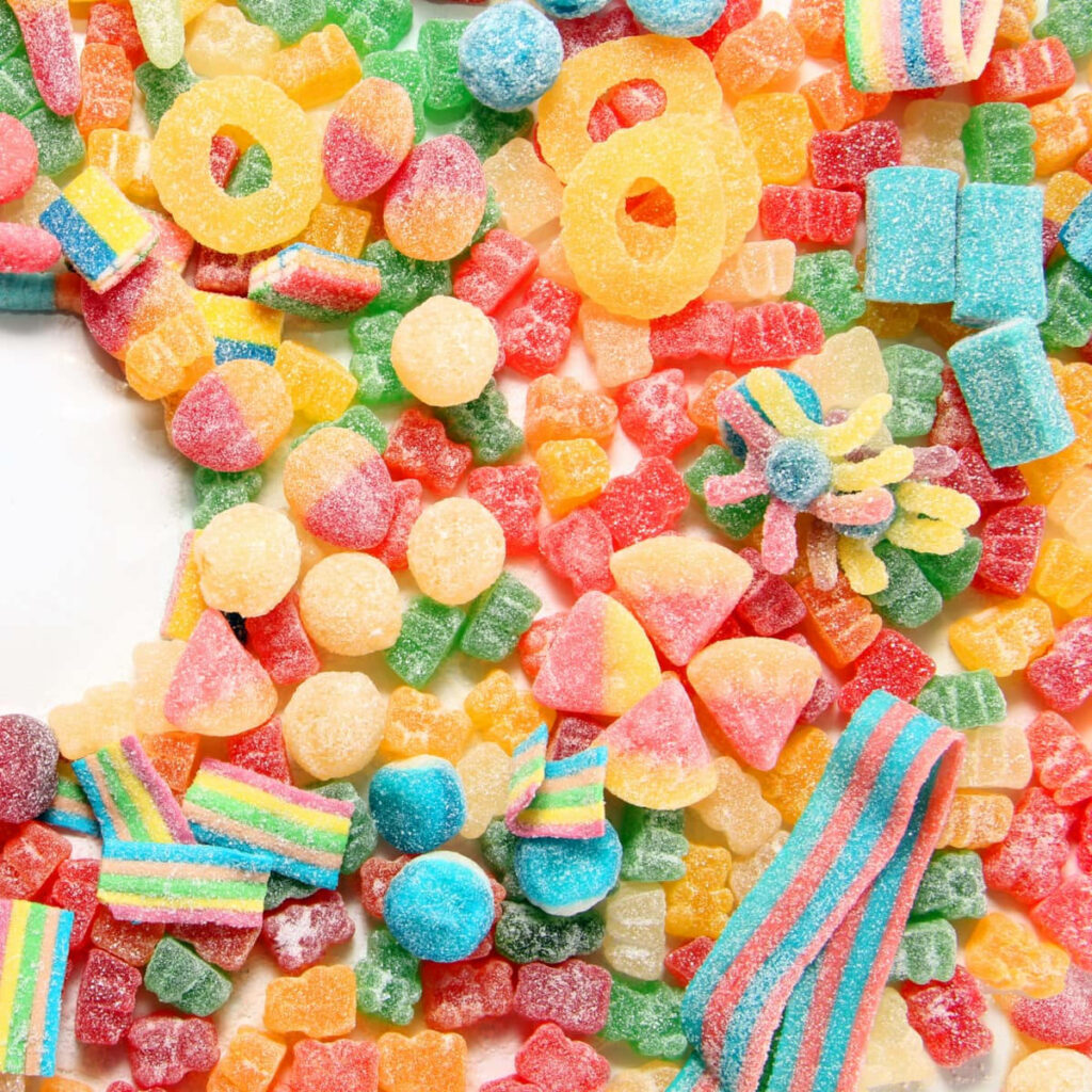 Vibrant Sour Candy Wallpaper: Colorful and Playful Background Design