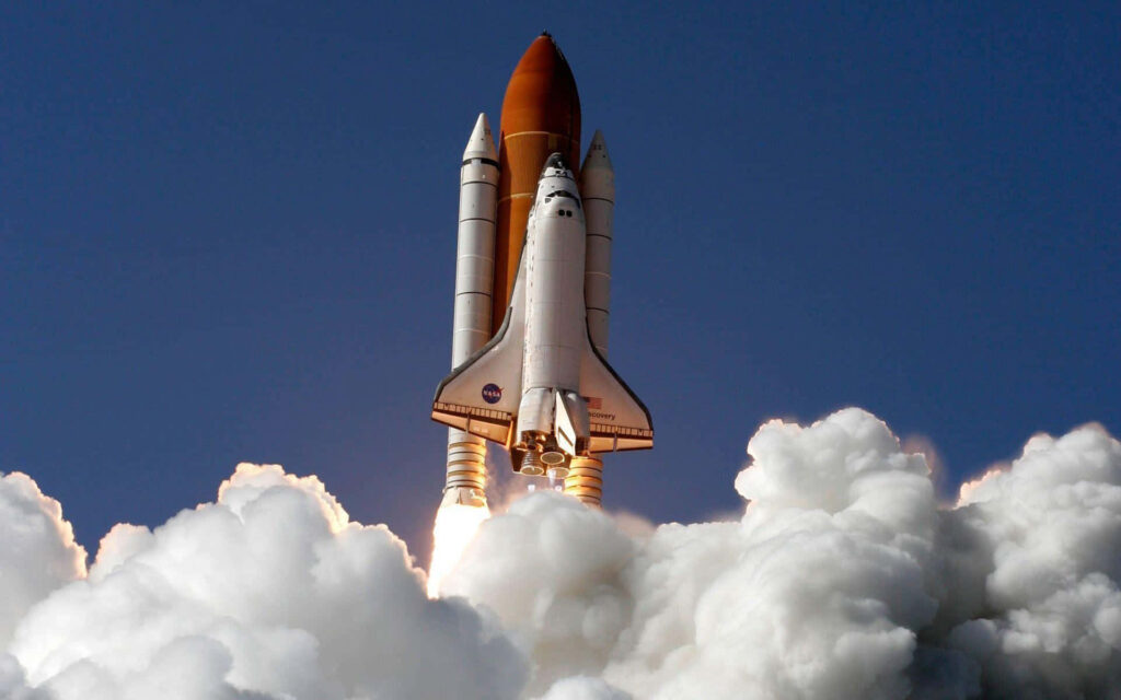 Vibrant Space Shuttle Discovery Launch Wallpaper - Clear Sky Background
