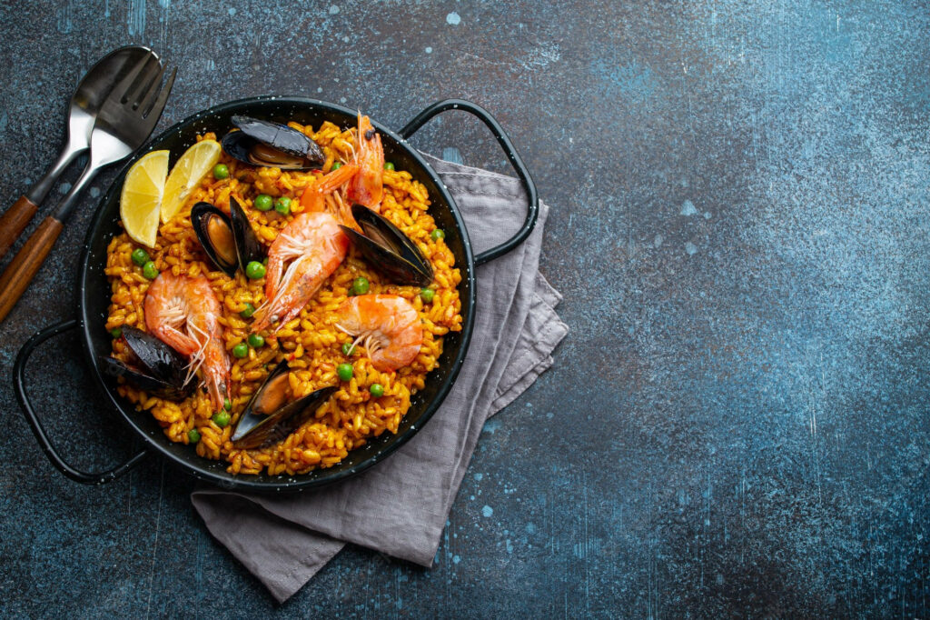 Vibrant Spanish Paella Wallpaper: Saffron Rice & Fresh Seafood