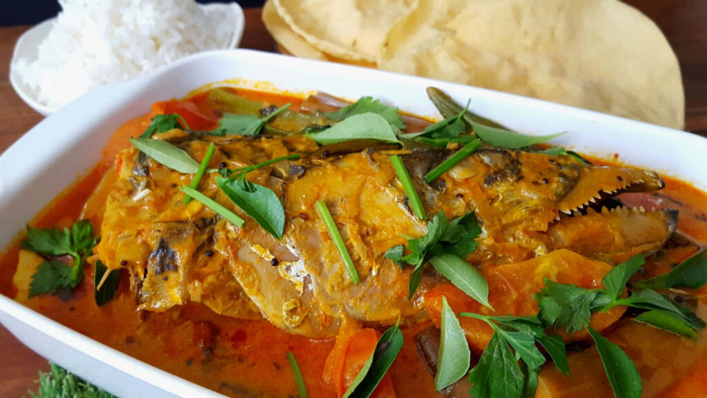Vibrant Spicy Fish Head Curry Close-Up with Rice & Papadum Wallpaper