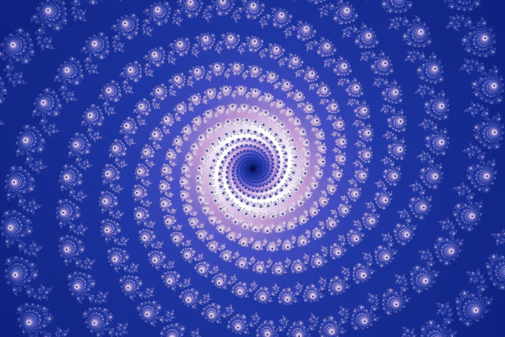 Vibrant Spiral Pattern Wallpaper on Rich Blue Background