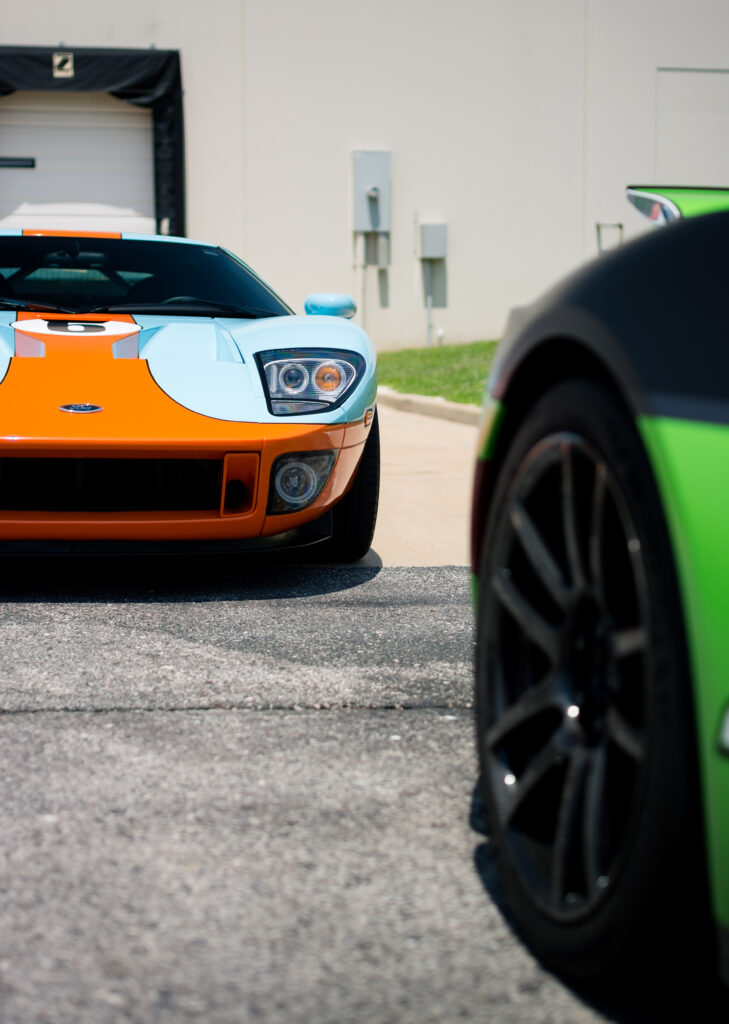 Sleek Sports Car Wallpaper: Front View in Vibrant Colors