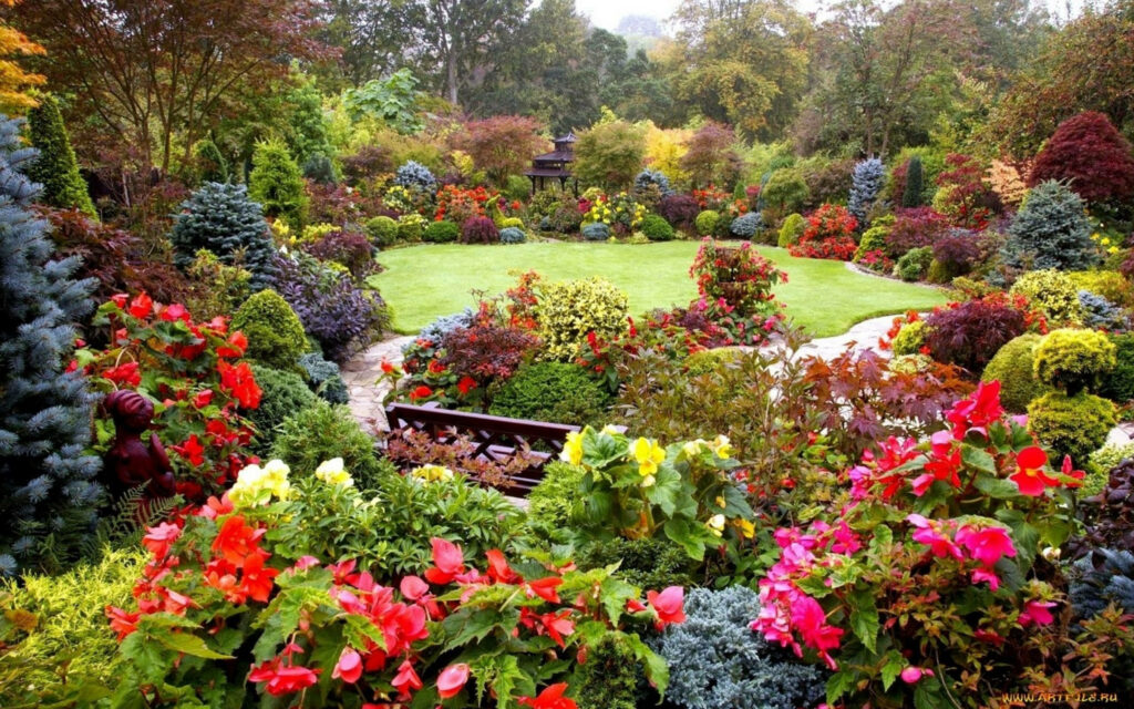 Vibrant Spring Garden with Colorful Flowers and Lush Greenery Wallpaper
