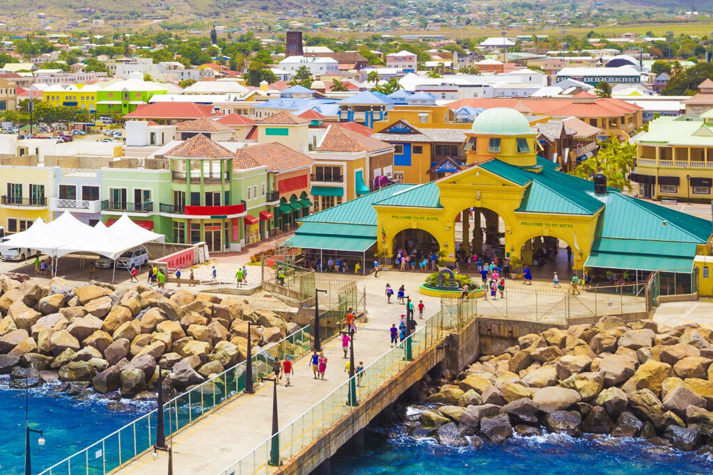 Vibrant St. Kitts Waterfront Scene: Colorful Architecture Wallpaper