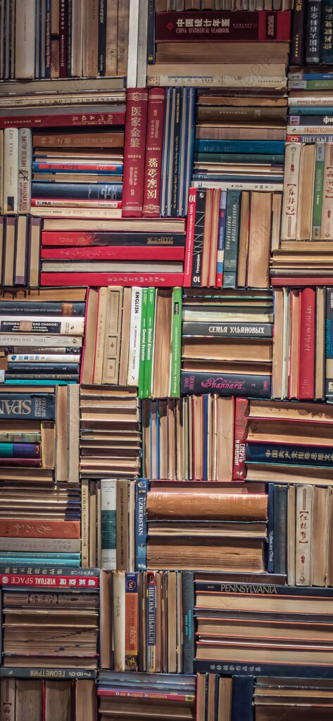 Colorful bookshelf wallpaper with stacked vibrant books arranged vertically and horizontally