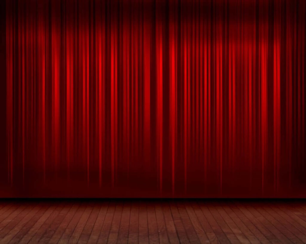 Unveiling the Drama: Stunning Stage with a Vibrant Red Curtain Wallpaper
