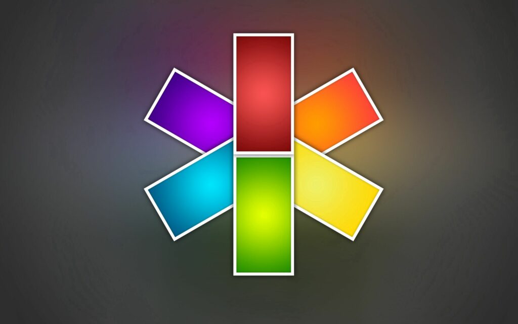 Vibrant Multi-Colored Star Wallpaper with Dark Gradient Background