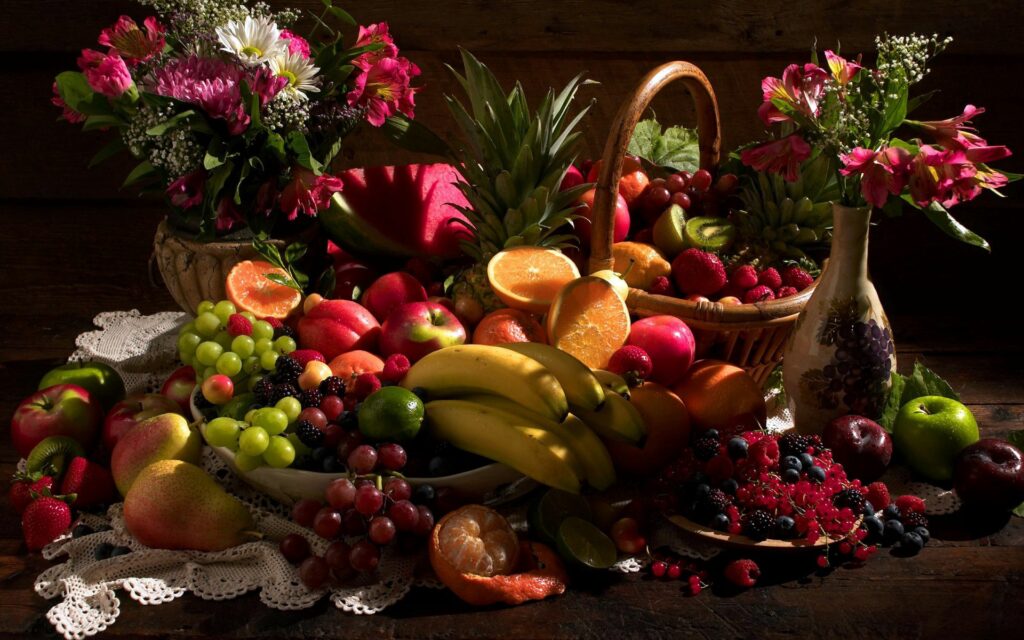 Vibrant Fruit Still Life Wallpaper: Fresh Fruits & Flowers Background