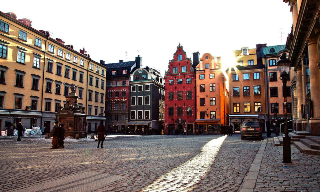 Vibrant Stockholm Wallpaper: Colorful Old Town Square & Cobblestone Streets