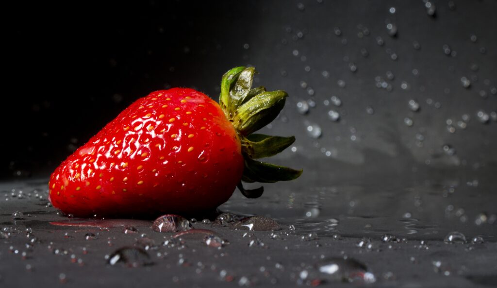 Fresh Strawberry Close-Up with Water Droplets - Dark Wallpaper
