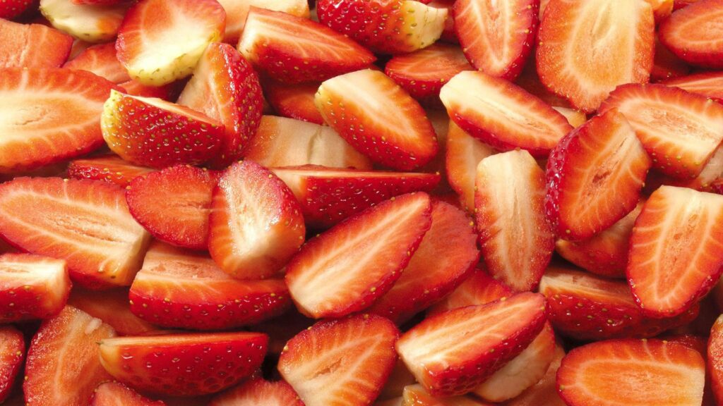 Vibrant Strawberry Segments Wallpaper Background – Juicy Red Delight