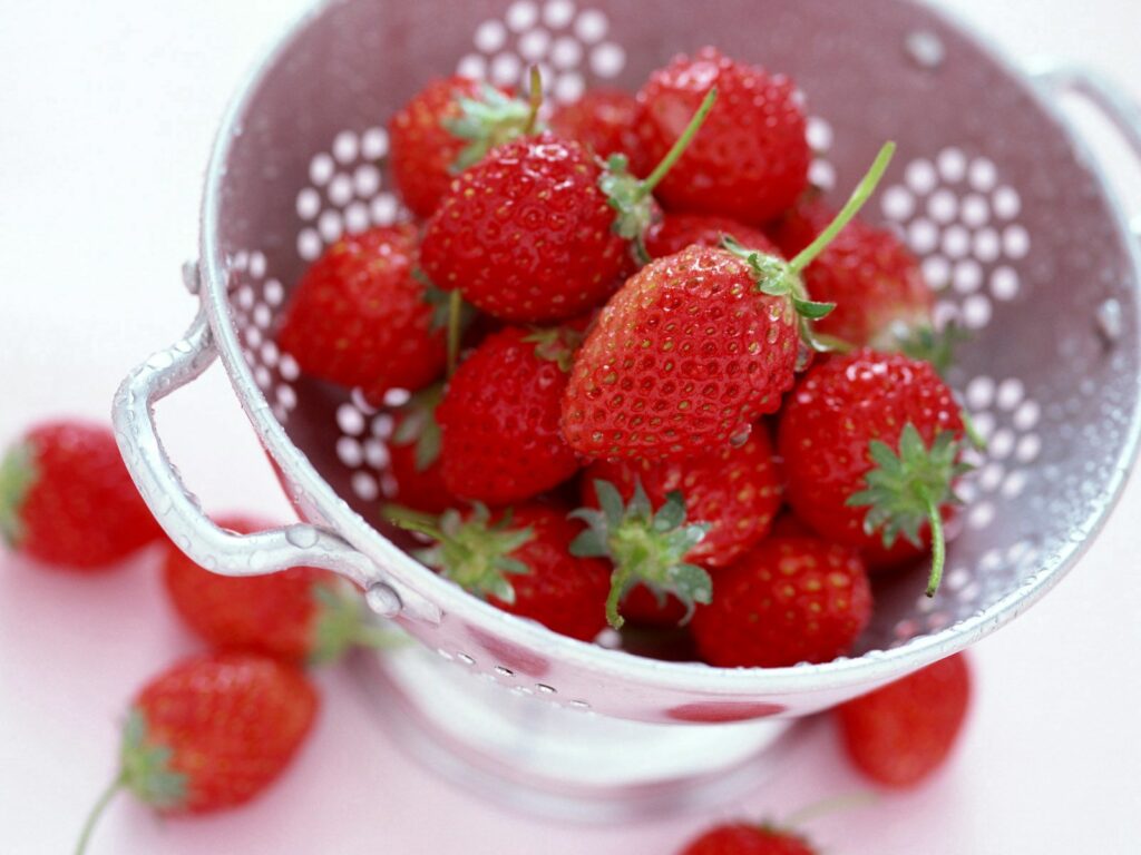 Vibrant Strawberry Wallpaper: Fresh Red Fruit in a Colander