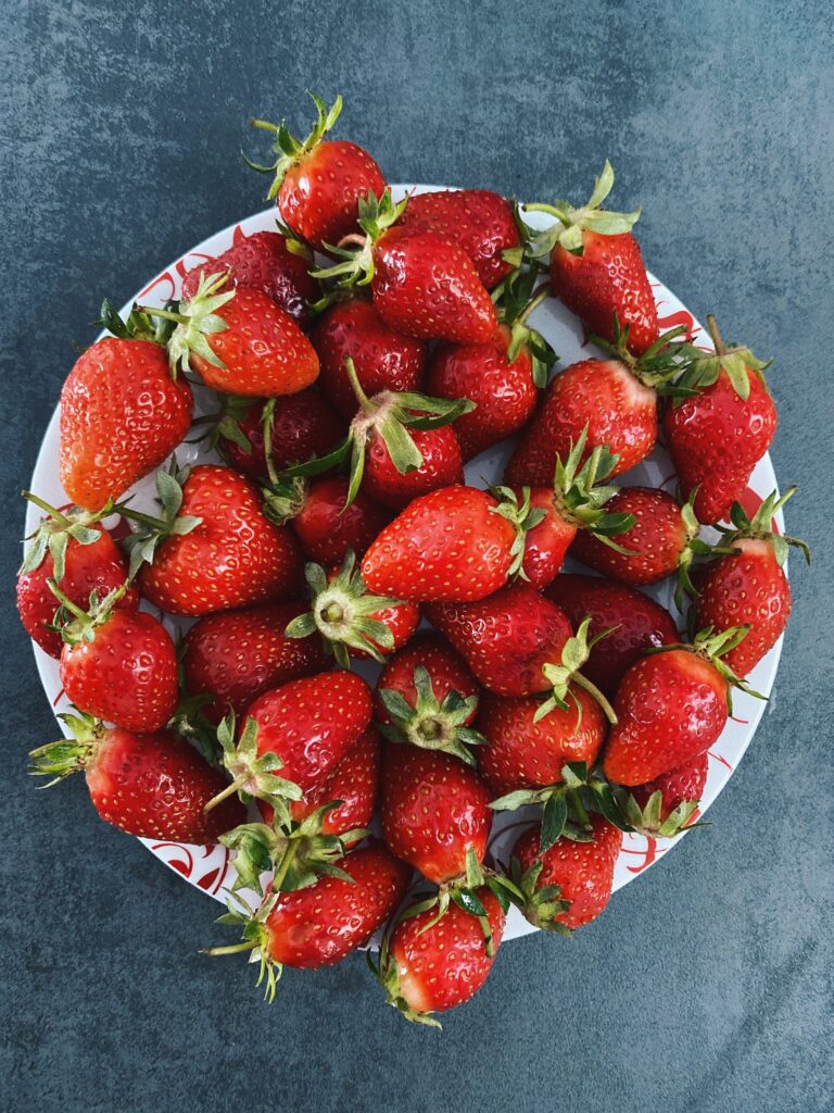 Vibrant Strawberry Wallpaper: Fresh Red Fruit on Simple Background