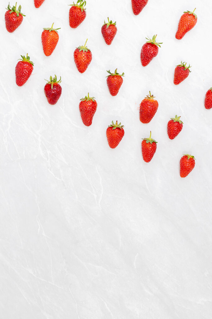 Vibrant Strawberry Wallpaper on White Marble - Fresh Minimalistic Design