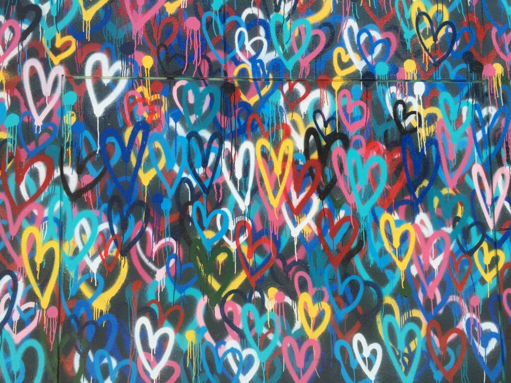 Vibrant Multicolored Heart Street Art Wallpaper - Urban Aesthetic