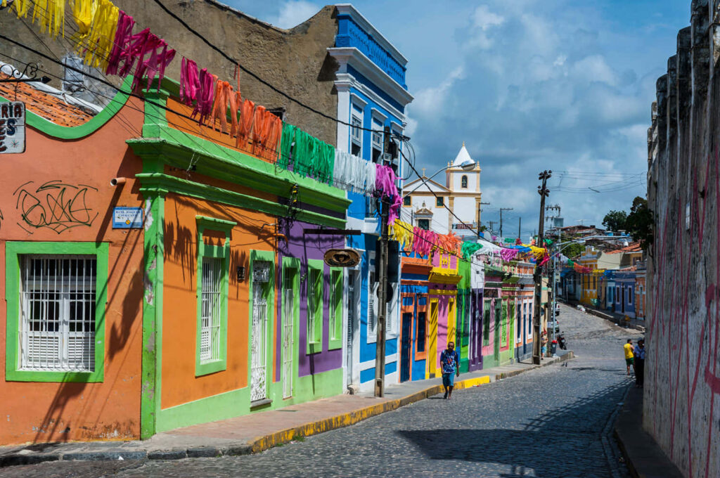 Colorful Street Scene Wallpaper: Vibrant Festive Charm Under Cloudy Sky