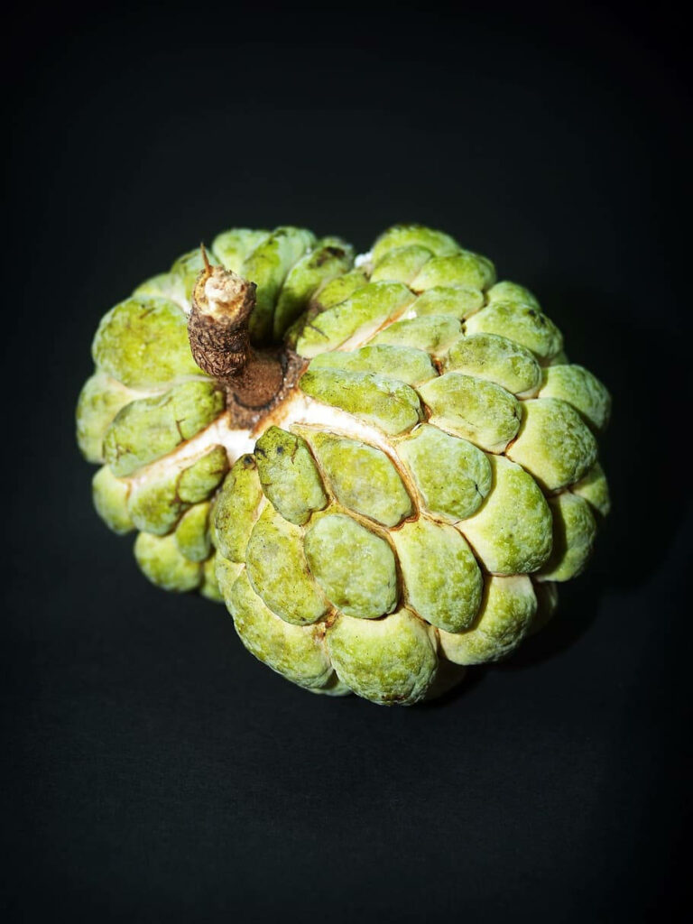 Vibrant Sugar Apple Wallpaper: Textured Green Fruit on Dark Background