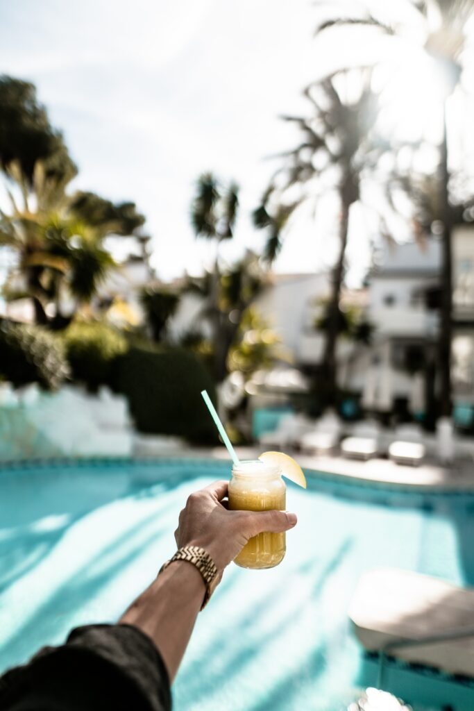 Vibrant Summer Cocktail Scene by Pool | Tropical Wallpaper Background
