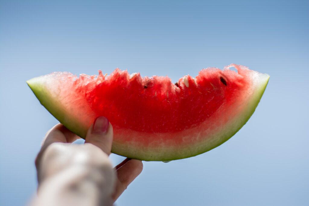 Juicy Watermelon Wallpaper: Refreshing Summer Vibe Against Blue Sky