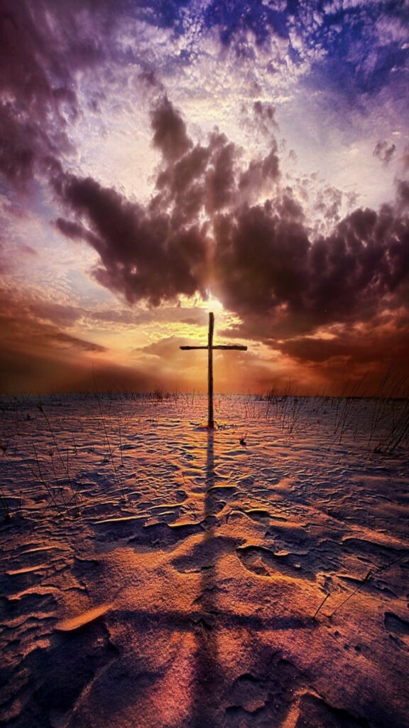 Stunning HD Phone Wallpaper: Cross on Sandy Landscape at Sunset