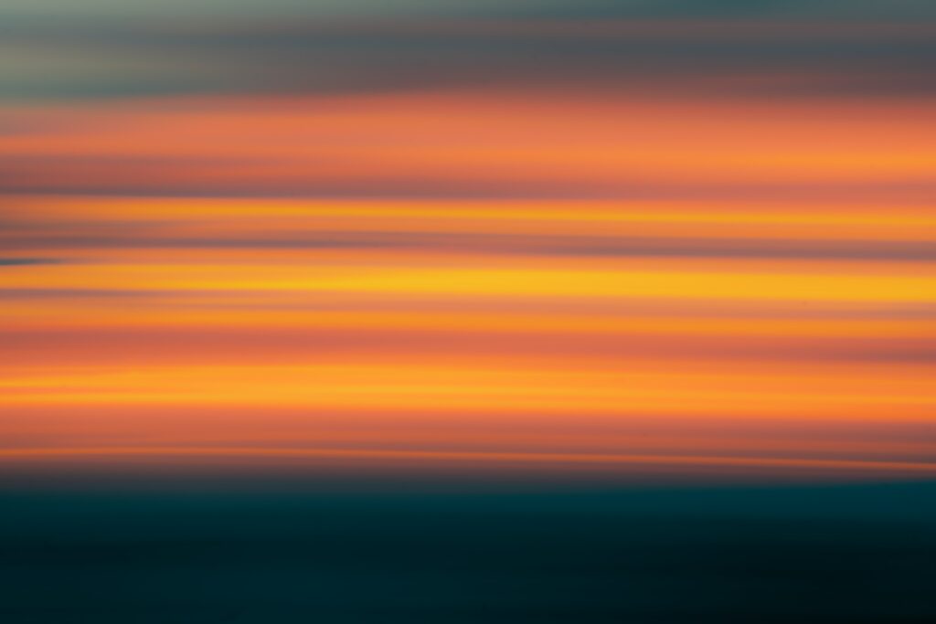 Vibrant Sunset Gradient Wallpaper - Blurred Stripes Background