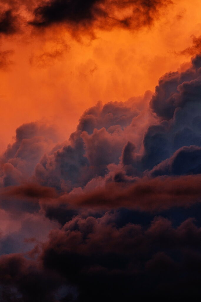 Vibrant HD Sunset Phone Wallpaper: Dramatic Cloudy Sky Background
