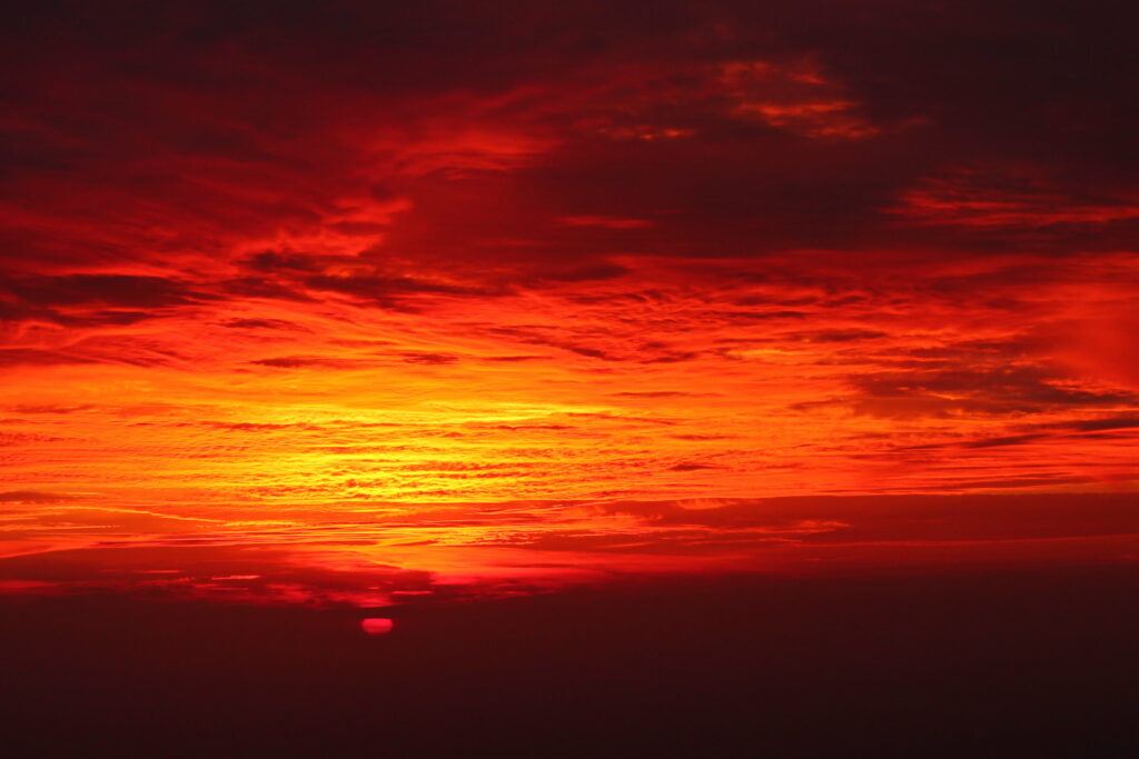 Vibrant Sunset HD Wallpaper: Fiery Red Sky & Dramatic Clouds Background