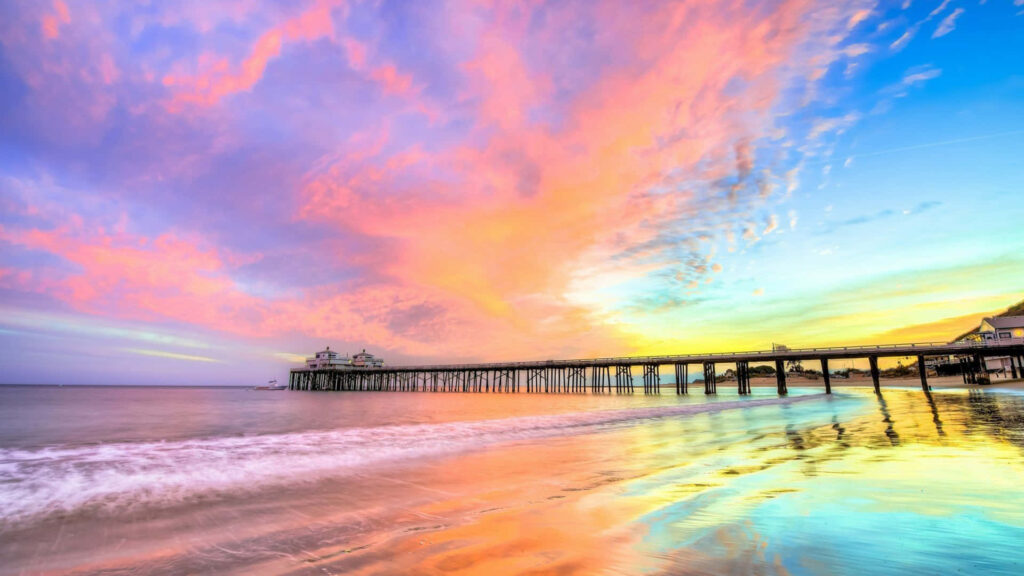 Vibrant Malibu Sunset Wallpaper: Pink, Orange & Blue Reflections