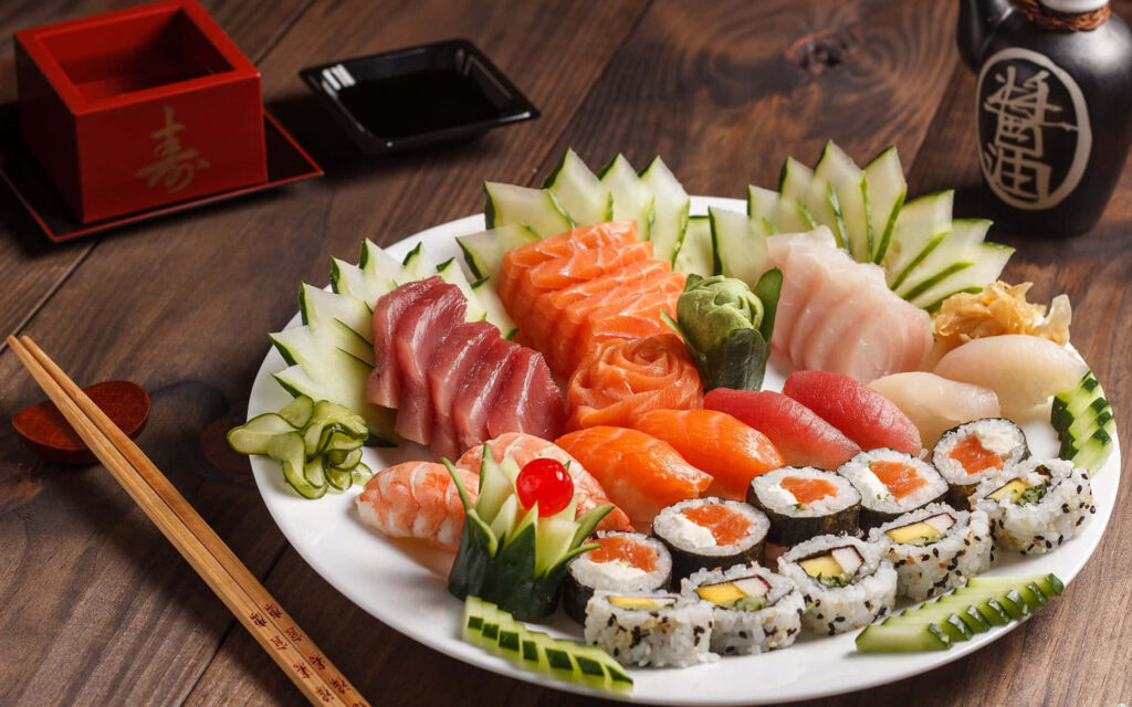 Vibrant Fresh Sushi Assortment Wallpaper with Cucumber Artistry