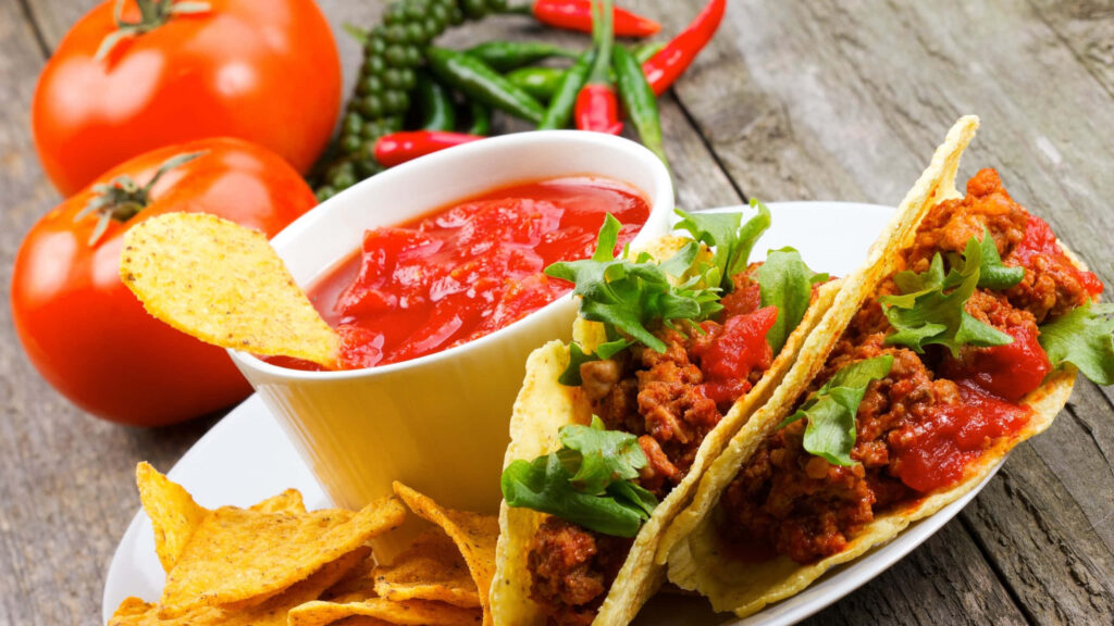 Vibrant Taco Wallpaper: Seasoned Meat, Lettuce, Salsa & Crispy Chips