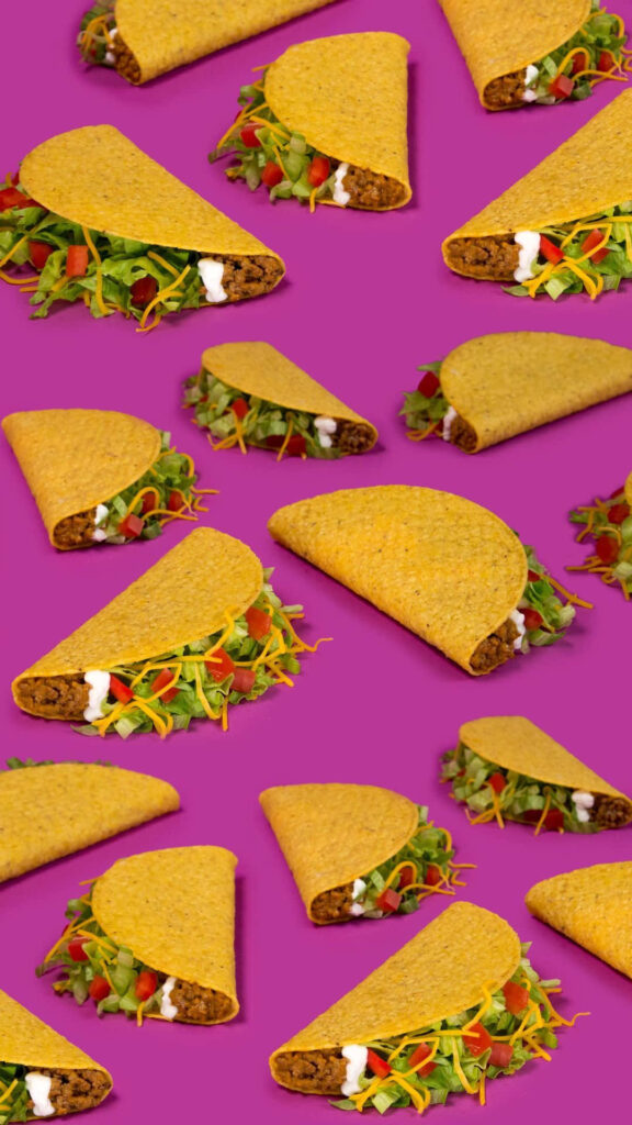 Vibrant Taco Wallpaper: Colorful Ingredients on Bold Purple Background