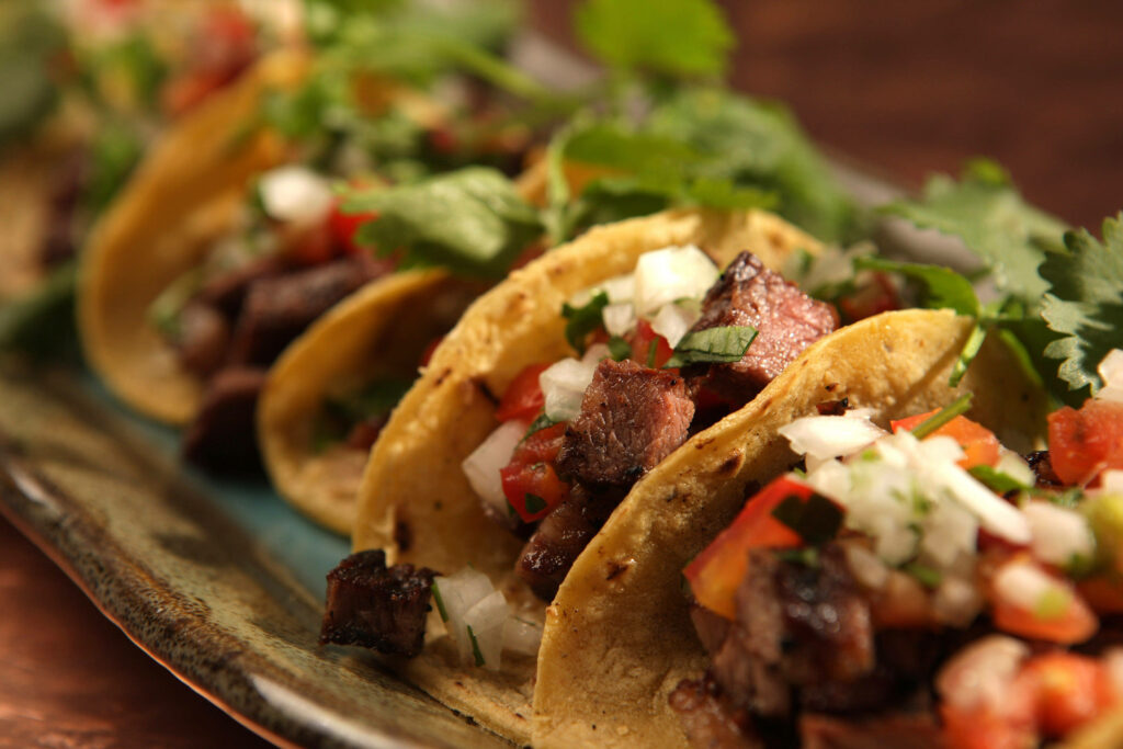 Vibrant Tacos Al Pastor Wallpaper: Authentic Mexican Flavor Background