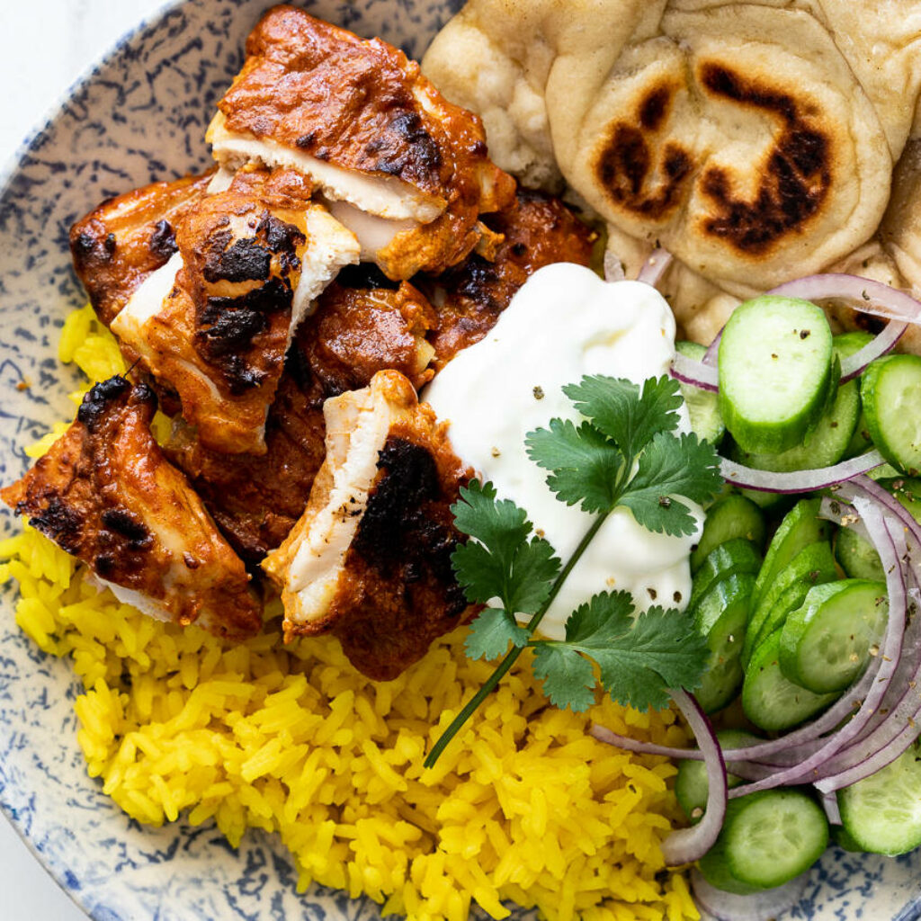 Vibrant Tandoori Chicken Wallpaper with Yellow Rice & Fresh Garnish