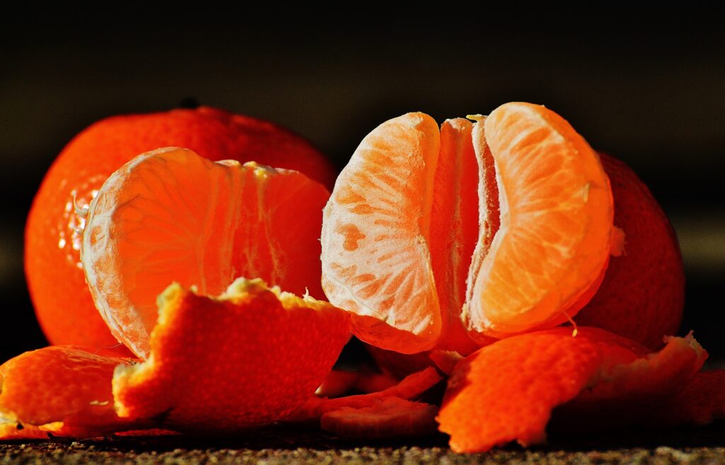 Fresh Tangerines Close-Up: Vibrant Orange Wallpaper Background