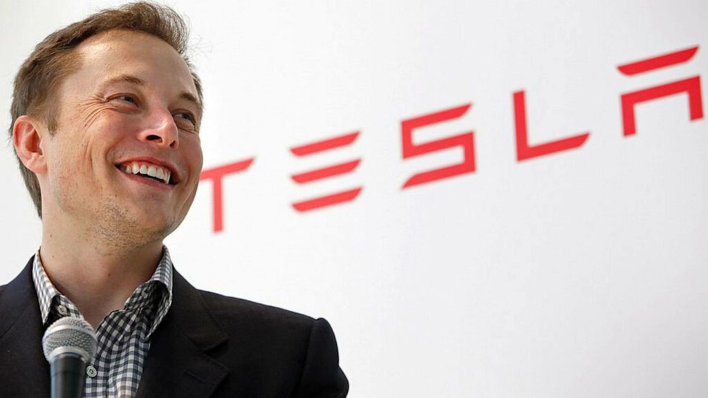 Elon Musk Wallpaper: Confident CEO with Tesla Logo & Innovation Theme
