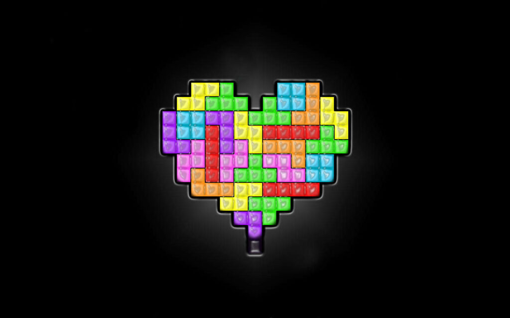 Vibrant Tetris Heart Wallpaper: Colorful Bricks on Black Background