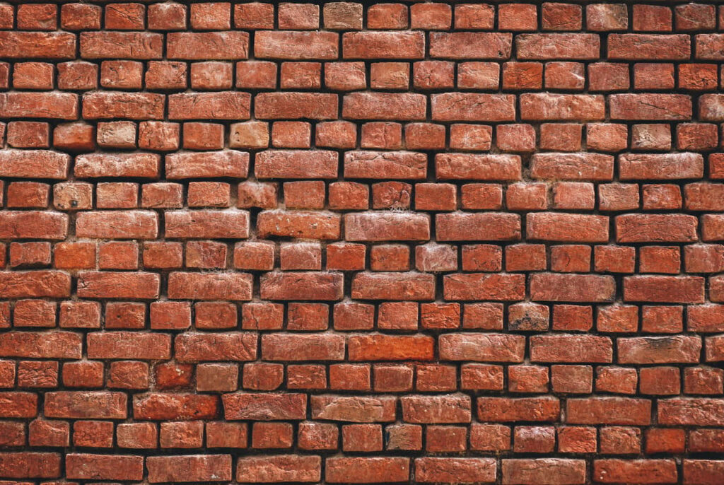 Vibrant Red Polished Brick Wall Wallpaper for Rustic Aesthetic