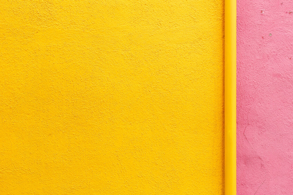 Vibrant Yellow and Peach Wallpaper Background with Textured Design