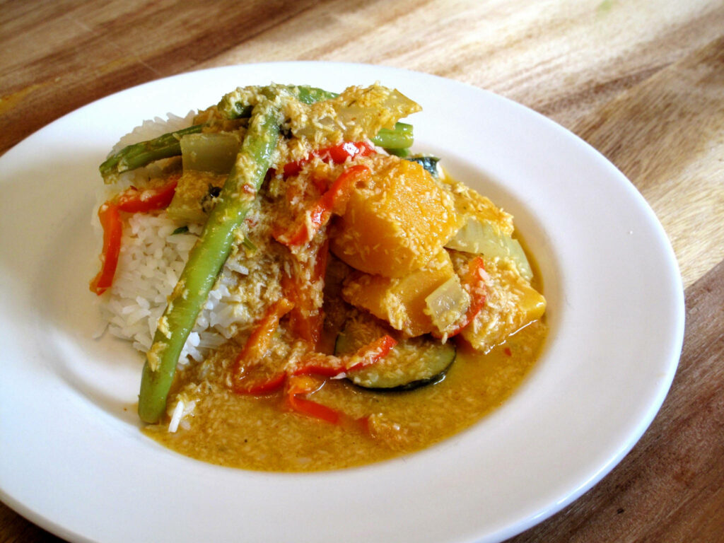 Vibrant Wallpaper of Red Thai Curry with Butternut Squash & Rice