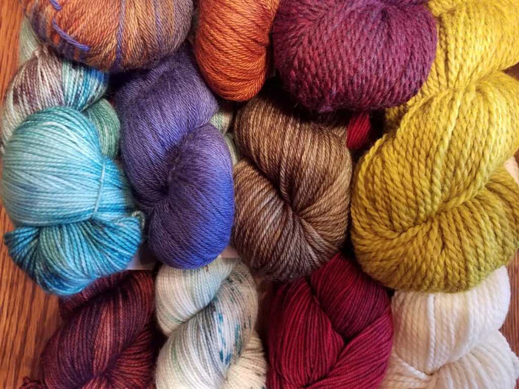 Bursting with Vibrant Fibers: Captivating Knitting Haven Wallpaper