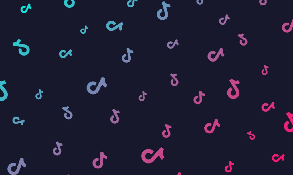 TikTok logo pattern wallpaper in blue pink and purple on dark background vibrant design