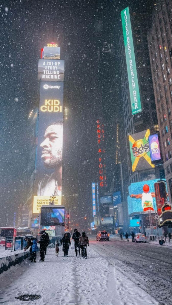 Vibrant Times Square Wallpaper: Snowy Evening with Kid Cudi Billboard