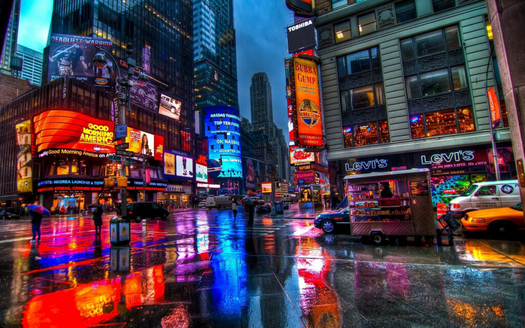 Vibrant Times Square Wallpaper: Illuminated Buildings & Colorful Reflections