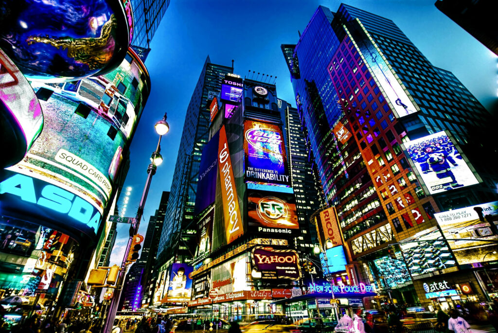 Vibrant Times Square Wallpaper: Illuminated Nightlife & Colorful Ads