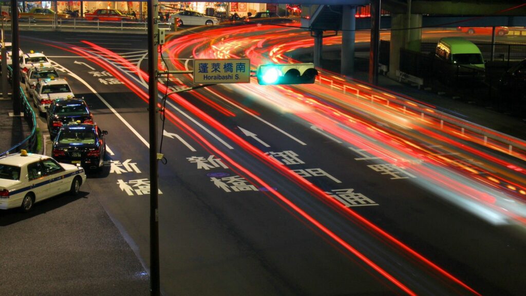 Vibrant Tokyo Night Highway Intersection Wallpaper Background