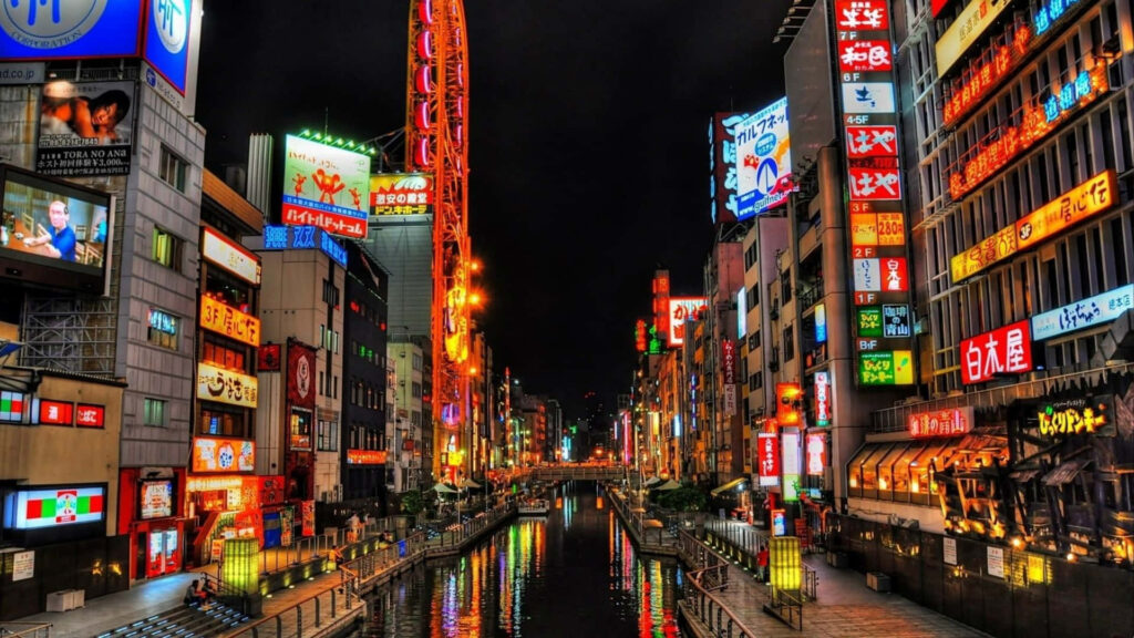 Vibrant Tokyo Night: Neon Reflections by the River Wallpaper